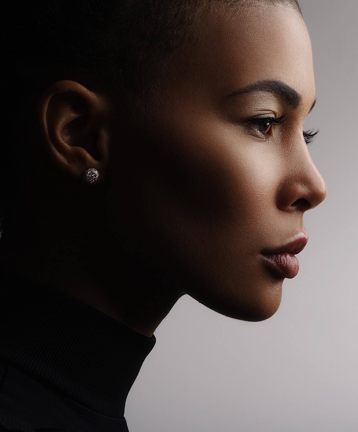 Profile portrait of a woman with elegant features.