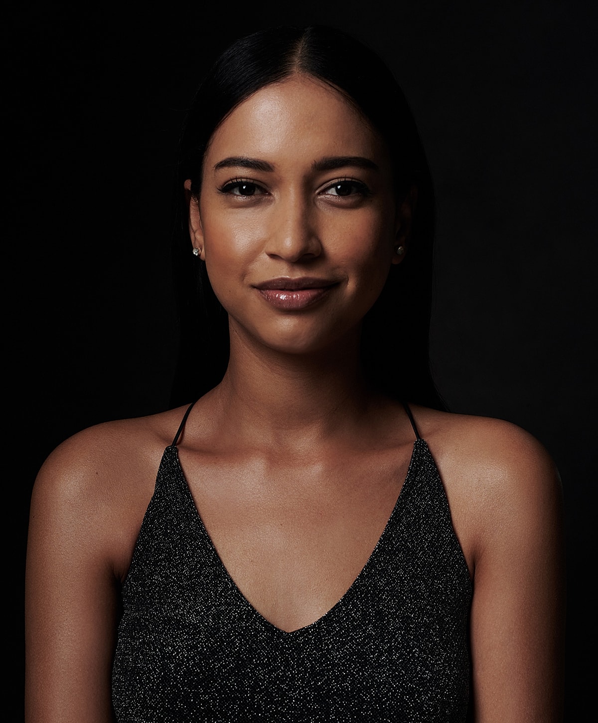 Portrait of a woman with dark hair.