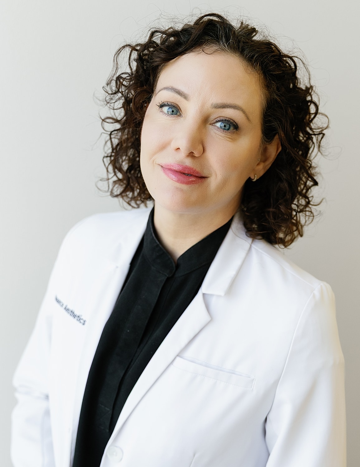 Professional woman in a white lab coat.