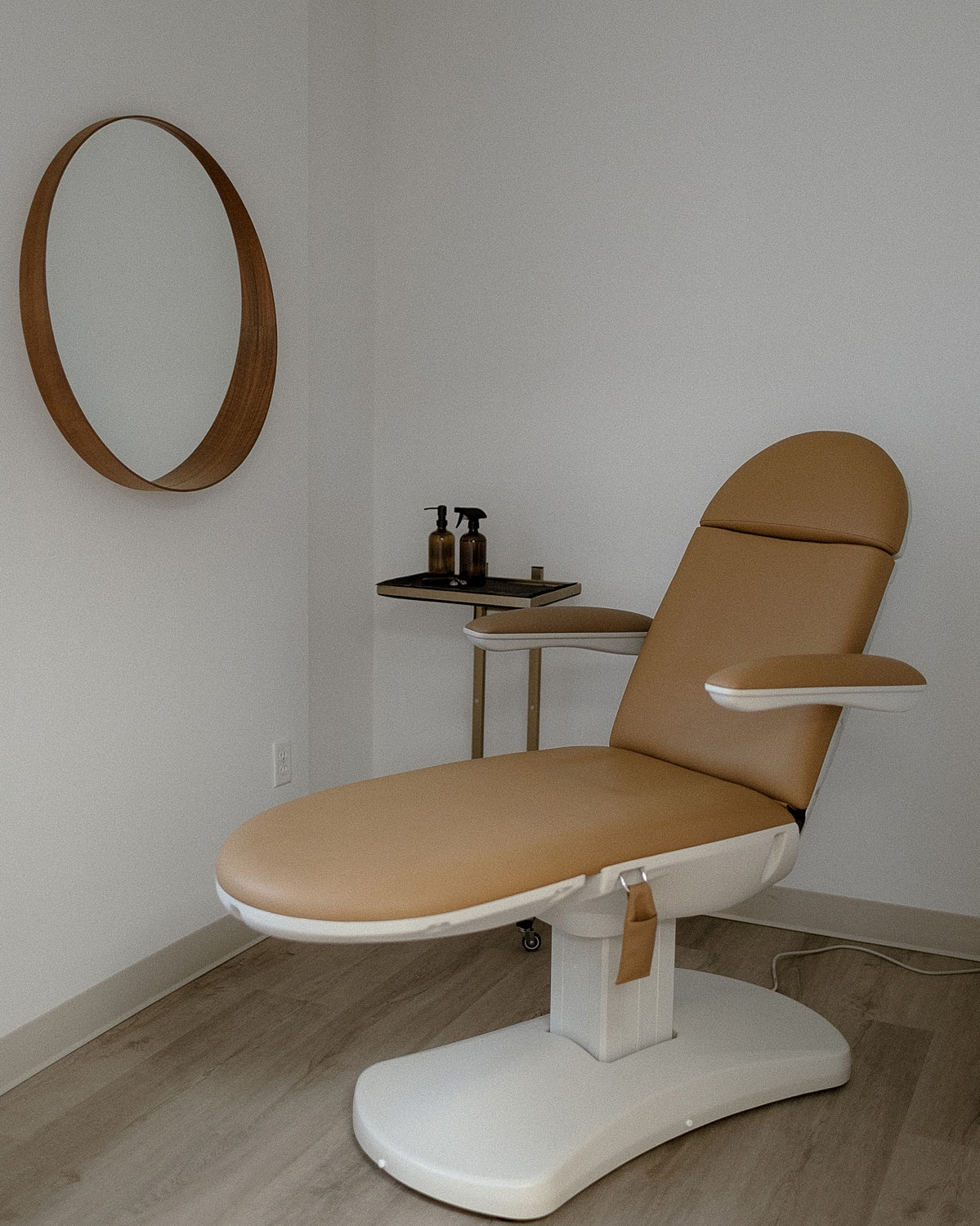 Optometry office with examination chair and windows.