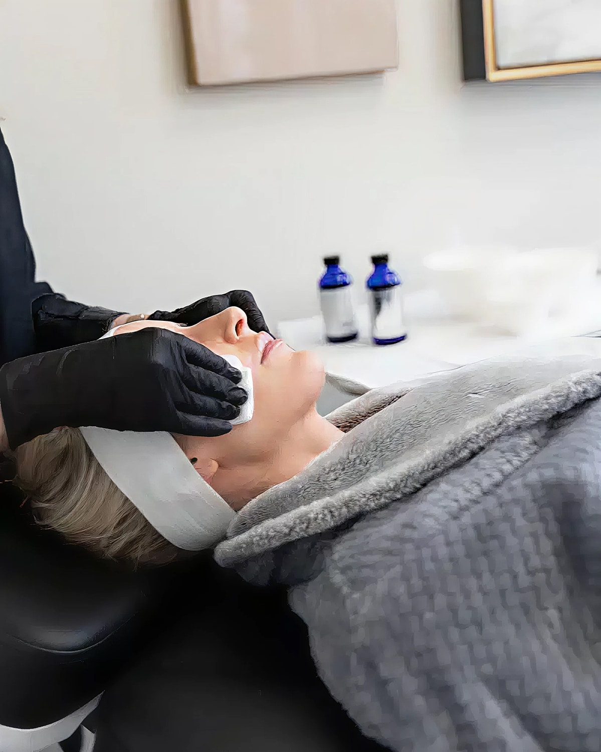 Facial treatment in a skincare salon setting.