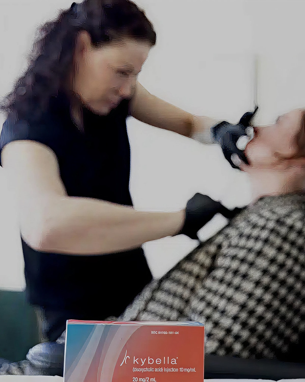 Kybella injection procedure in progress.