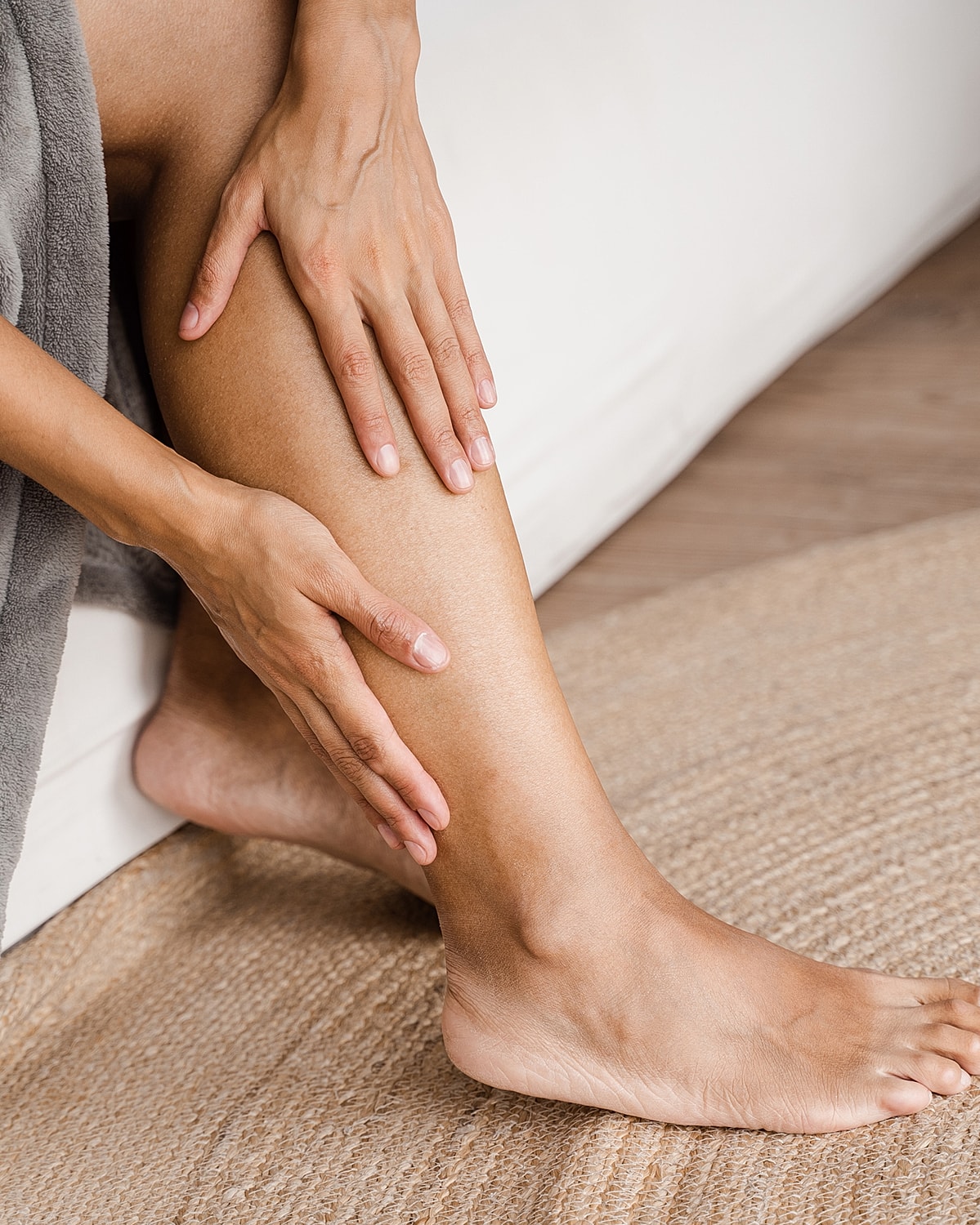 Caring touch on leg and foot.