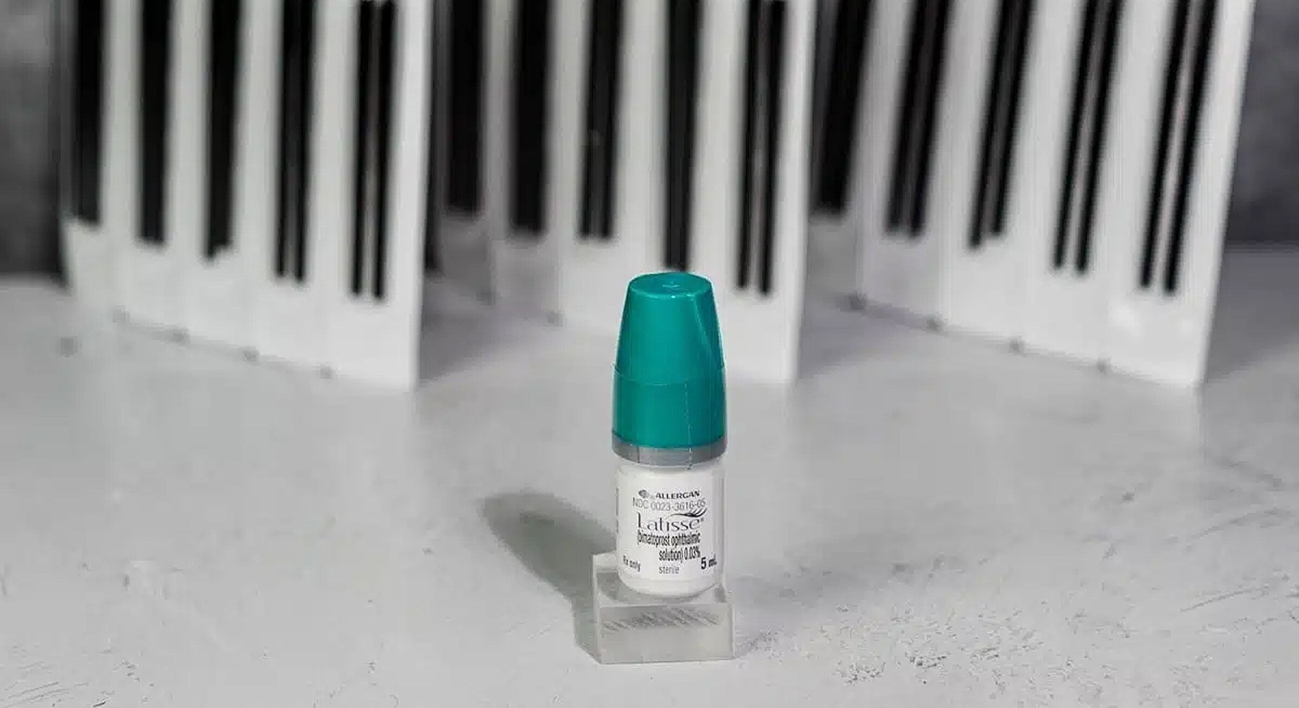 Bottled product in front of piano keys.